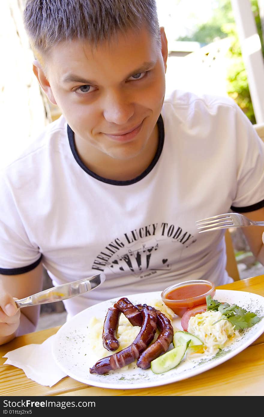 Man is dinning in the cafe. Man is dinning in the cafe.