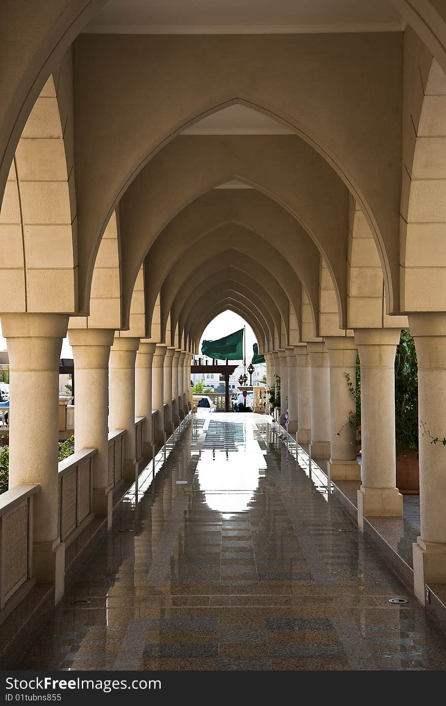 A long arch path leading to flag