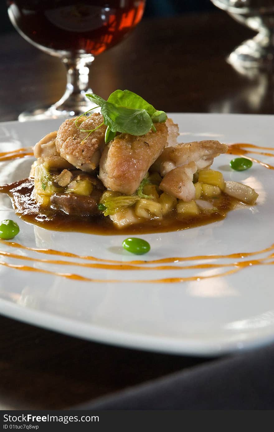 Battered sweetbreads over seasonal vegetables with dark beer