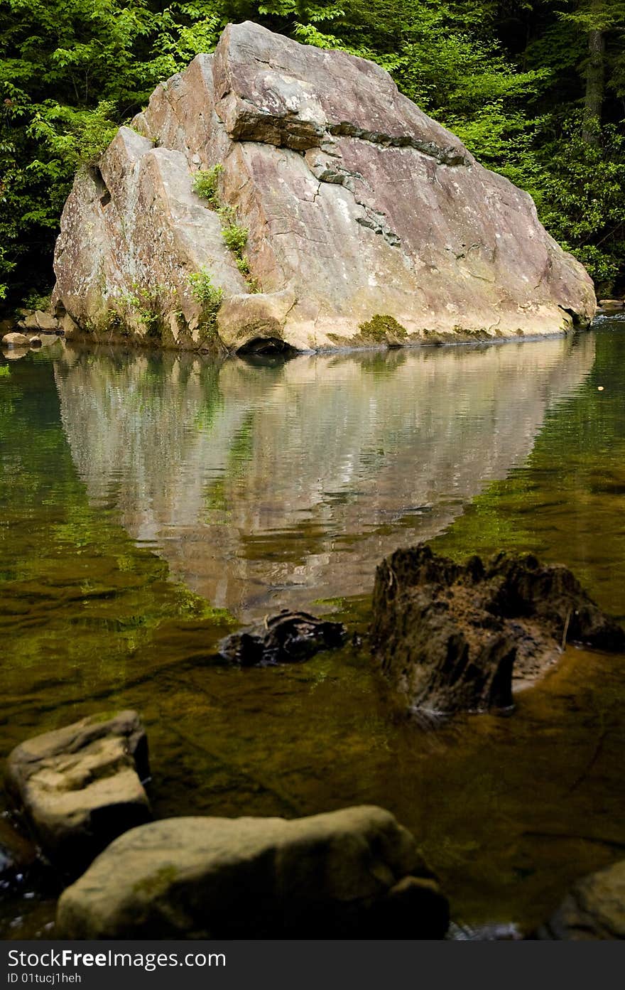 Reflection of a rock in a creek. Reflection of a rock in a creek