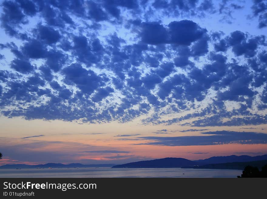 Colorful sky scene at sunset above sea. Colorful sky scene at sunset above sea