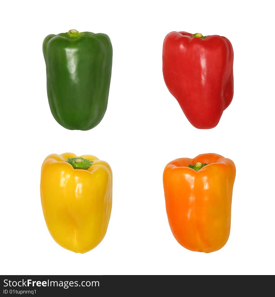 Peppers in the colors of green, red, orange and yellow, isolated over white background. Peppers in the colors of green, red, orange and yellow, isolated over white background.