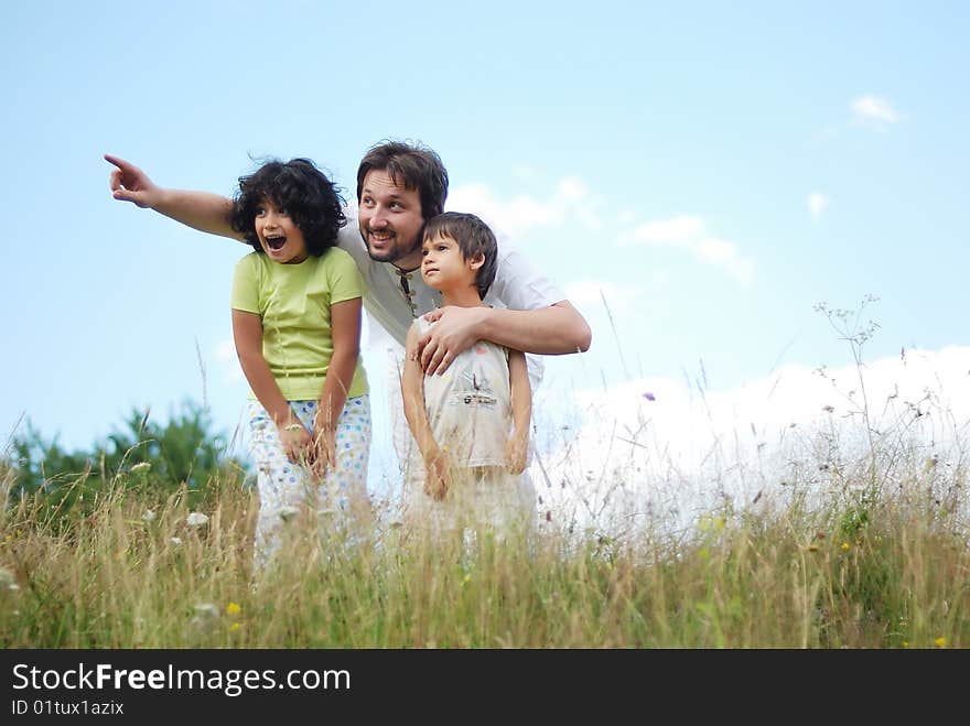 Father, daughter and son in nature