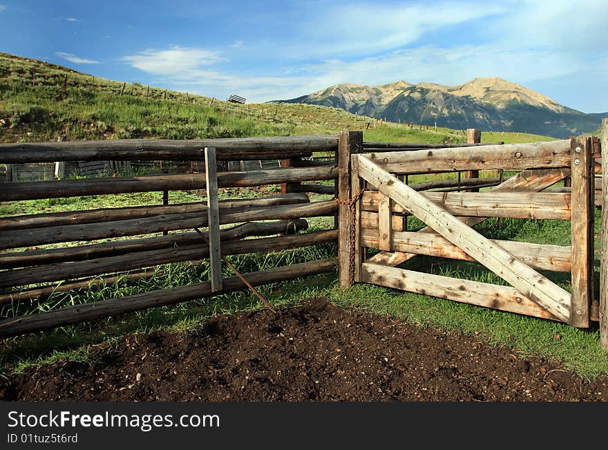 Ranch rural of weathered wooden fence in the mountains in the summer. Ranch rural of weathered wooden fence in the mountains in the summer.