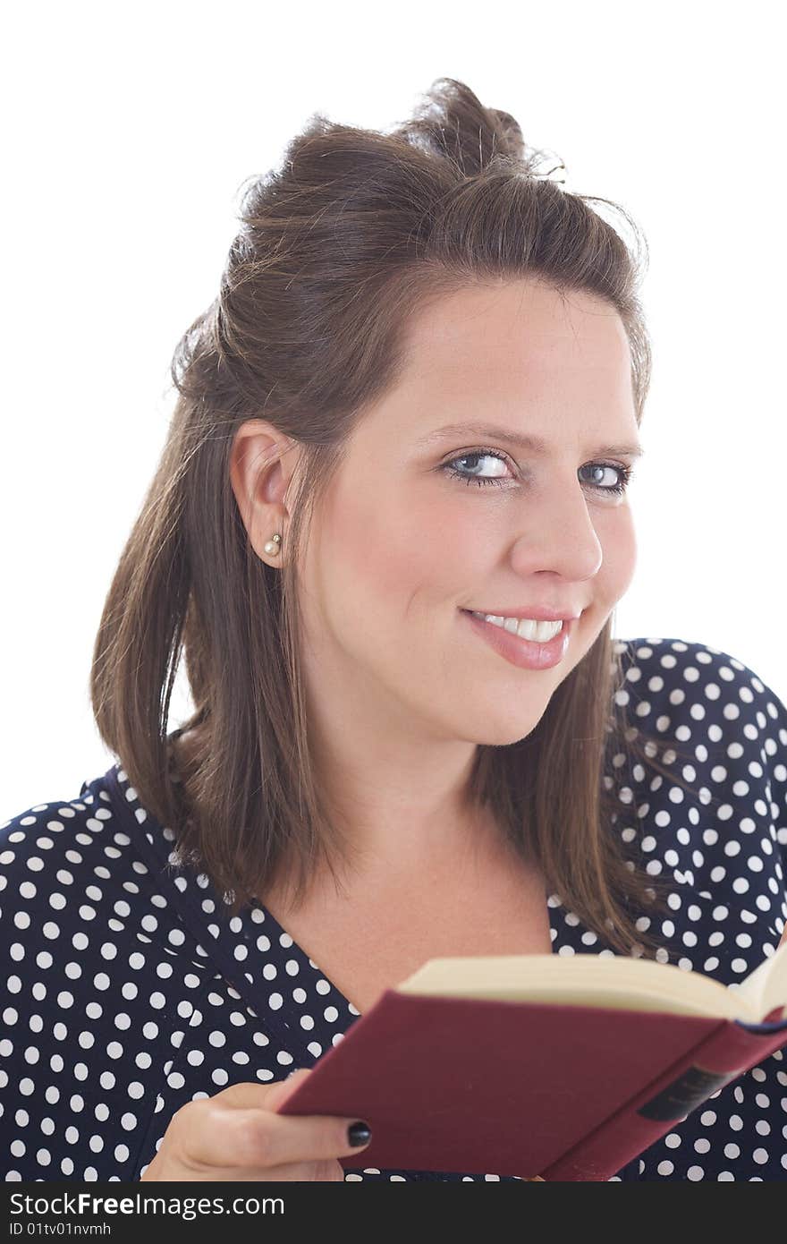 Young business woman looks up from reading a book; isolated on a white background. Young business woman looks up from reading a book; isolated on a white background.