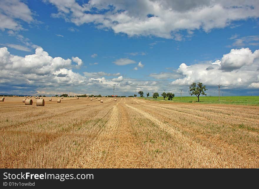 View on fields after harvest with a beautiful summer sky. View on fields after harvest with a beautiful summer sky