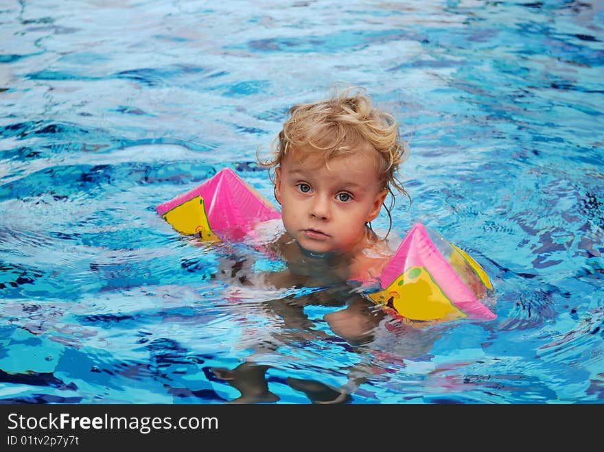 Little girl in swimming pool