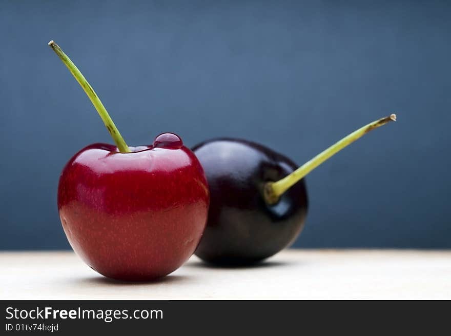 Cherries on blue background