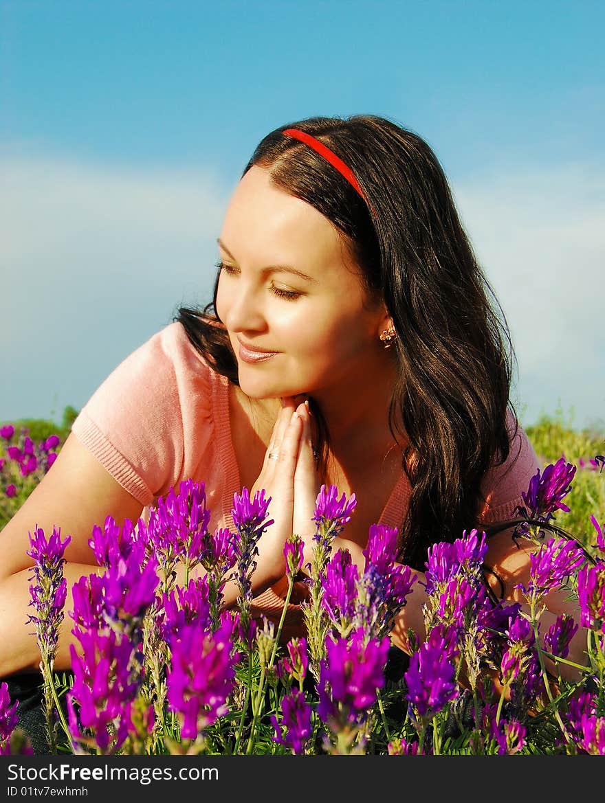 Young woman in the field of violet f