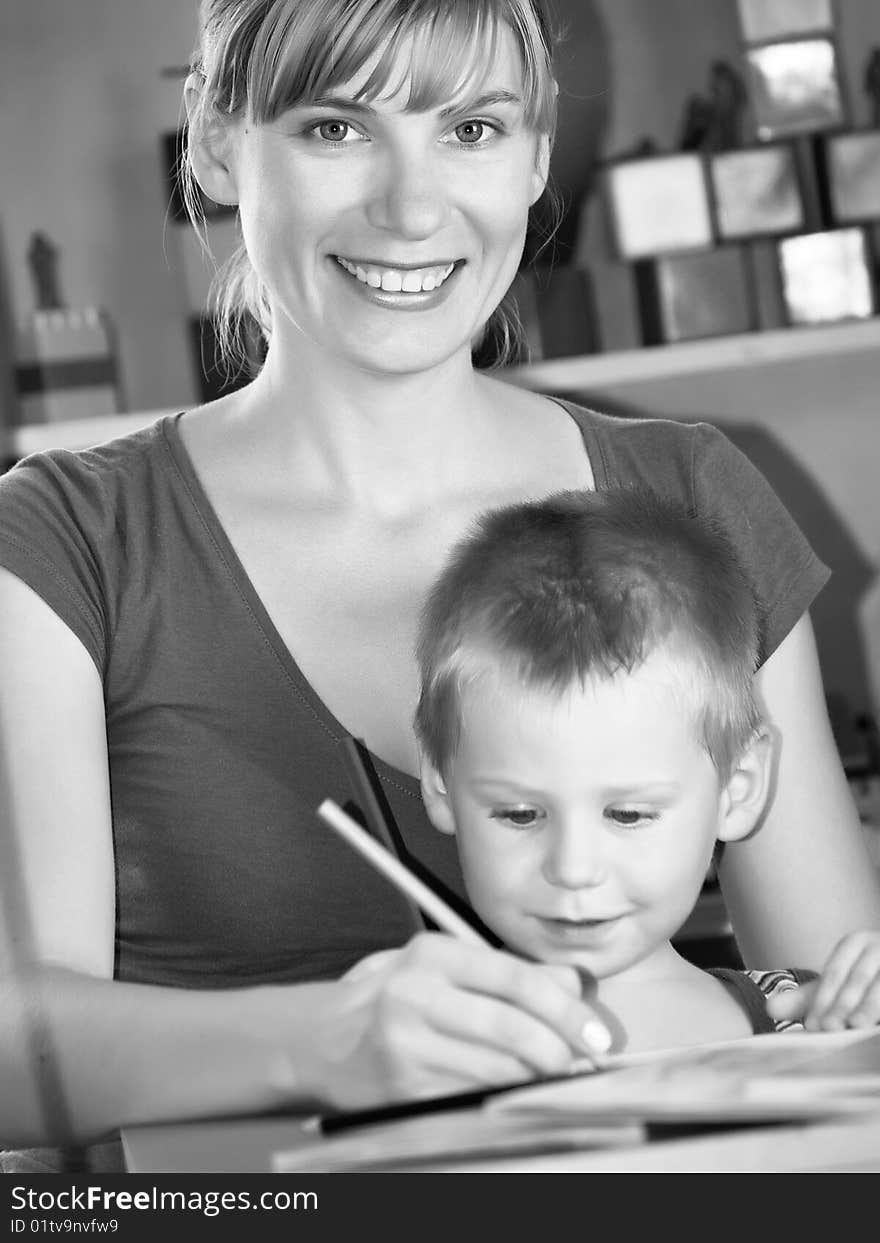 The mum with son is engaged in a children's room. The mum with son is engaged in a children's room