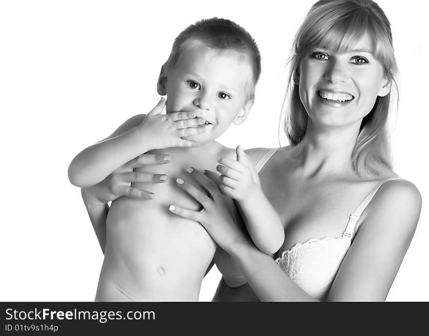 Young mum with the small son on a white background. Black and white. Young mum with the small son on a white background. Black and white