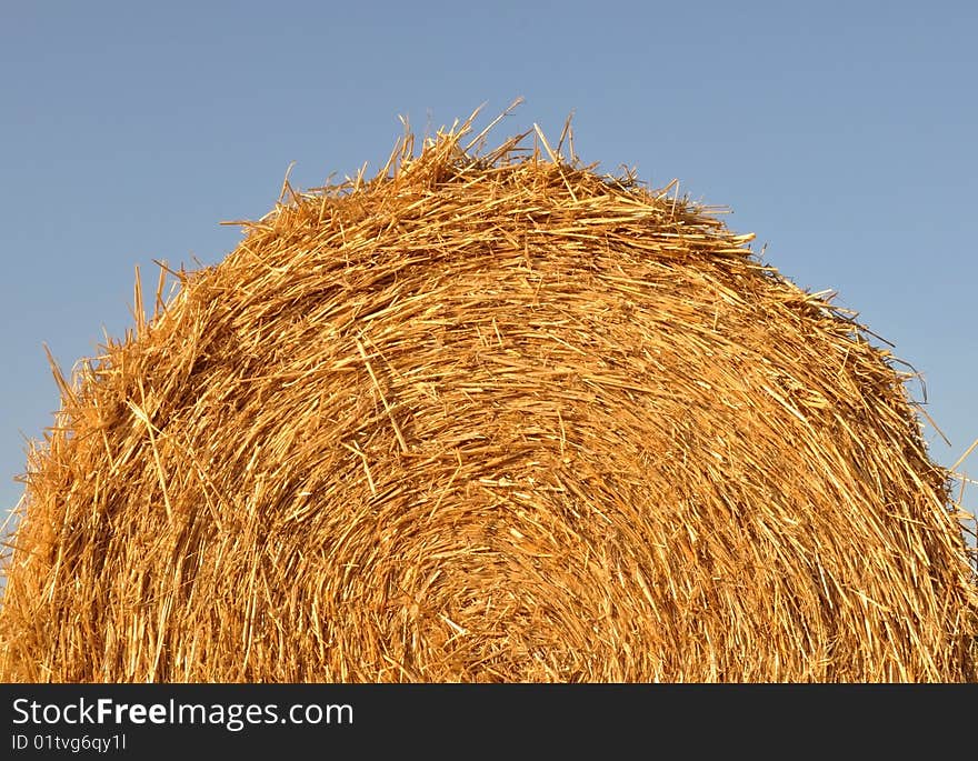 Harvested haystack detail on a wheat-field