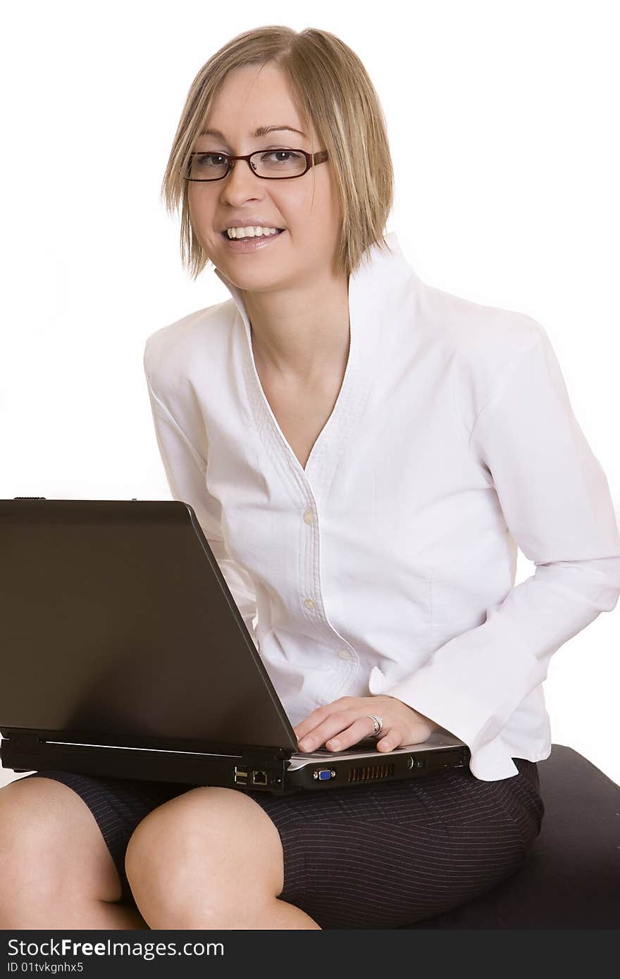 Young woman sitting with a laptop. Young woman sitting with a laptop