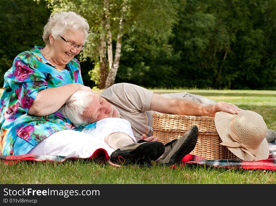 Grandmother Is Tickling Grandfather