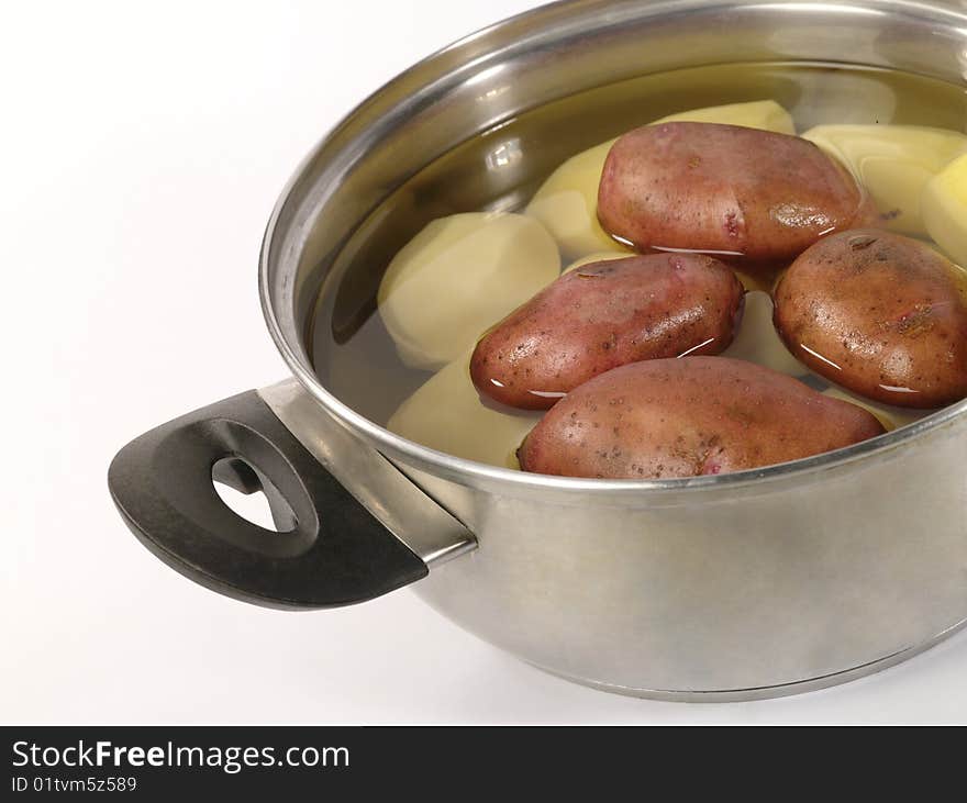 Fresh raw potatoes into the steel pan.