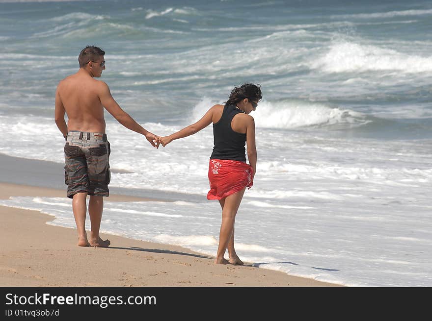 Attractive lovely couple on the beach