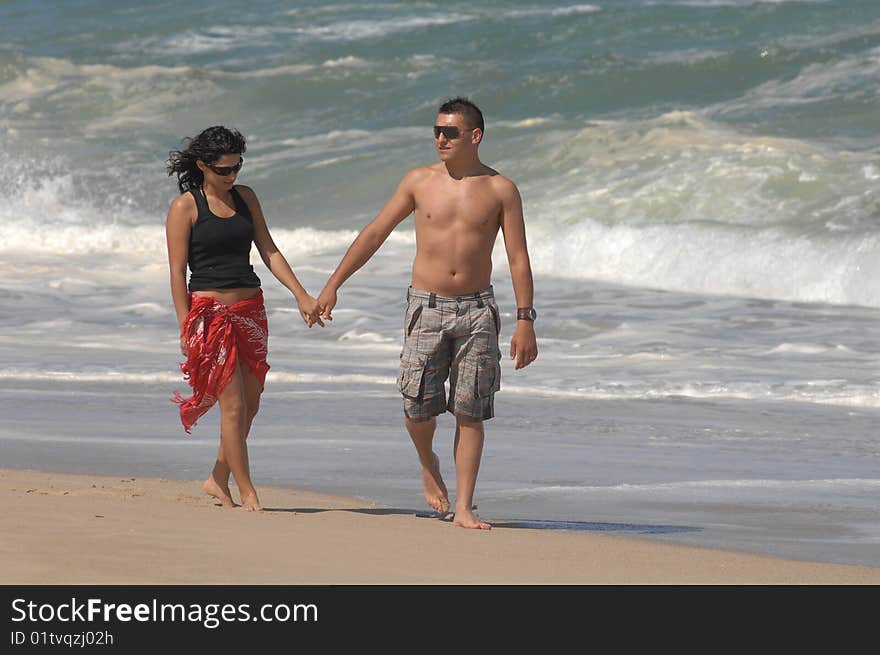 A attractive lovely couple on the beach