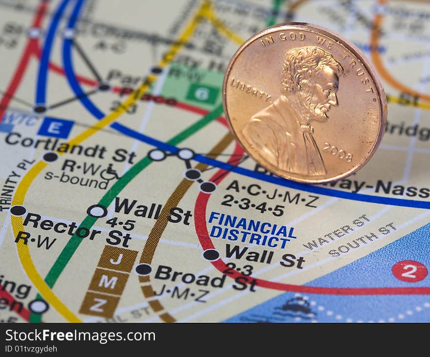 American penny on a subway map representing economy.