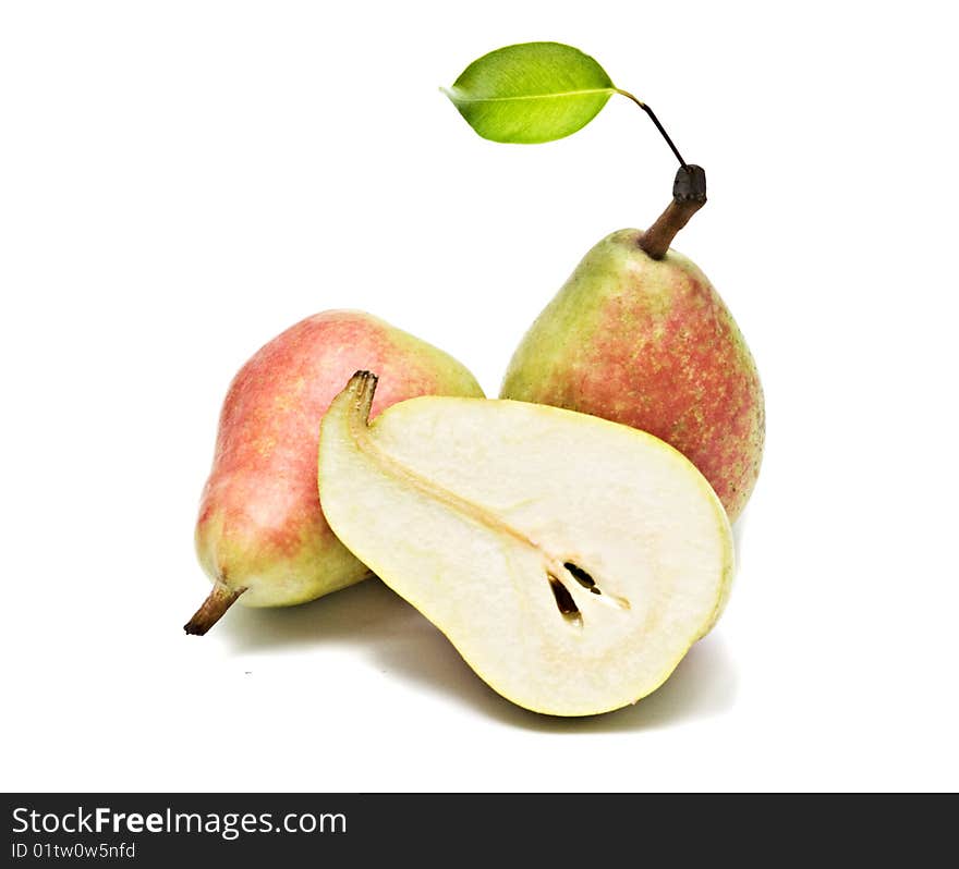 Two pears and half isolated on white background