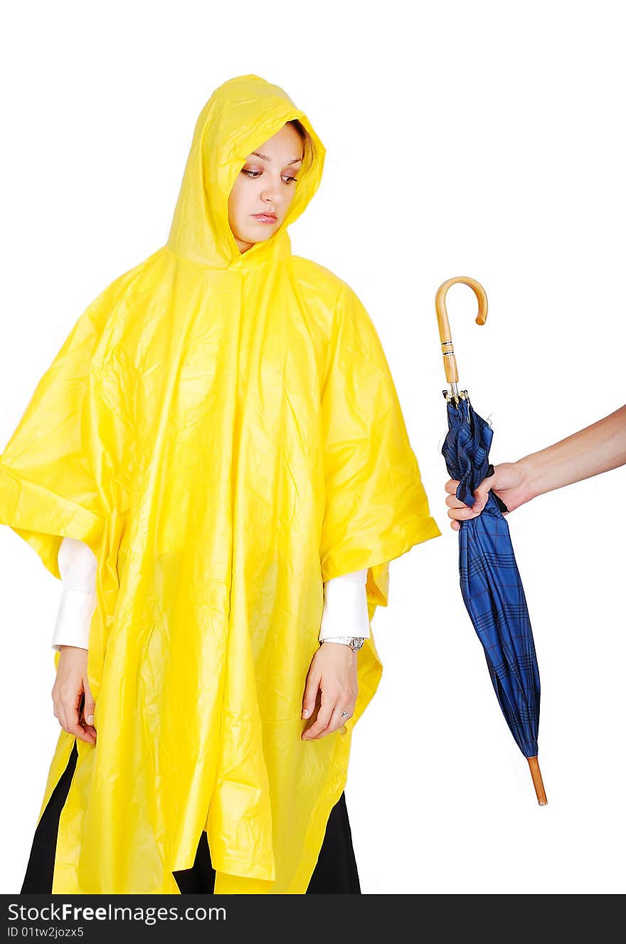 Nice model in yellow hood has been offered an umbrella