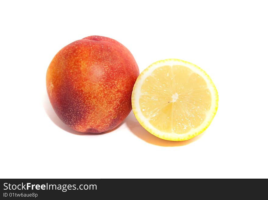 Lemon half and nectarine isolated on white. Lemon half and nectarine isolated on white