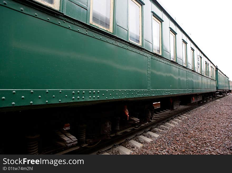 Side of green passenger train. Side of green passenger train