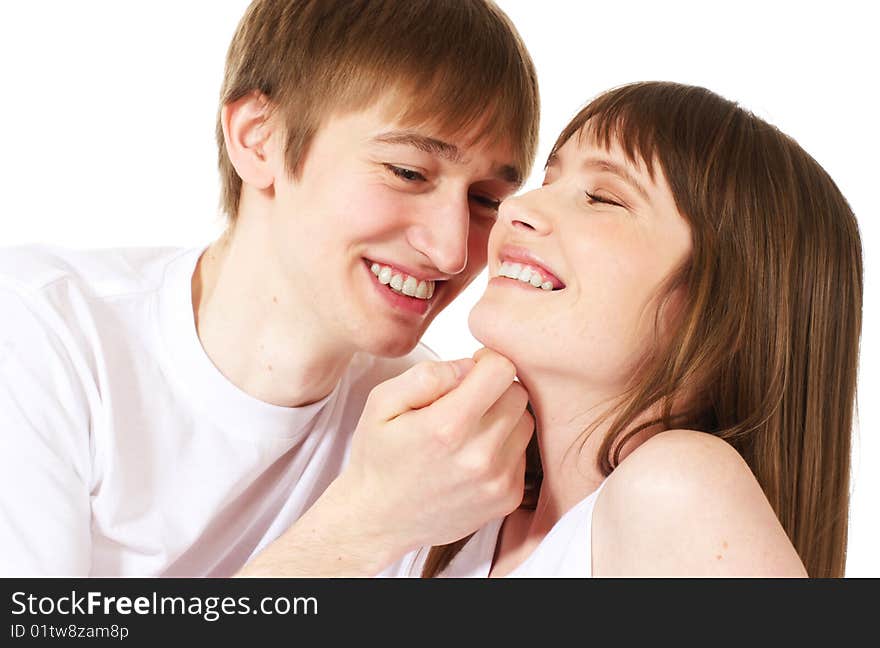 Laughing young couple on white background. Laughing young couple on white background