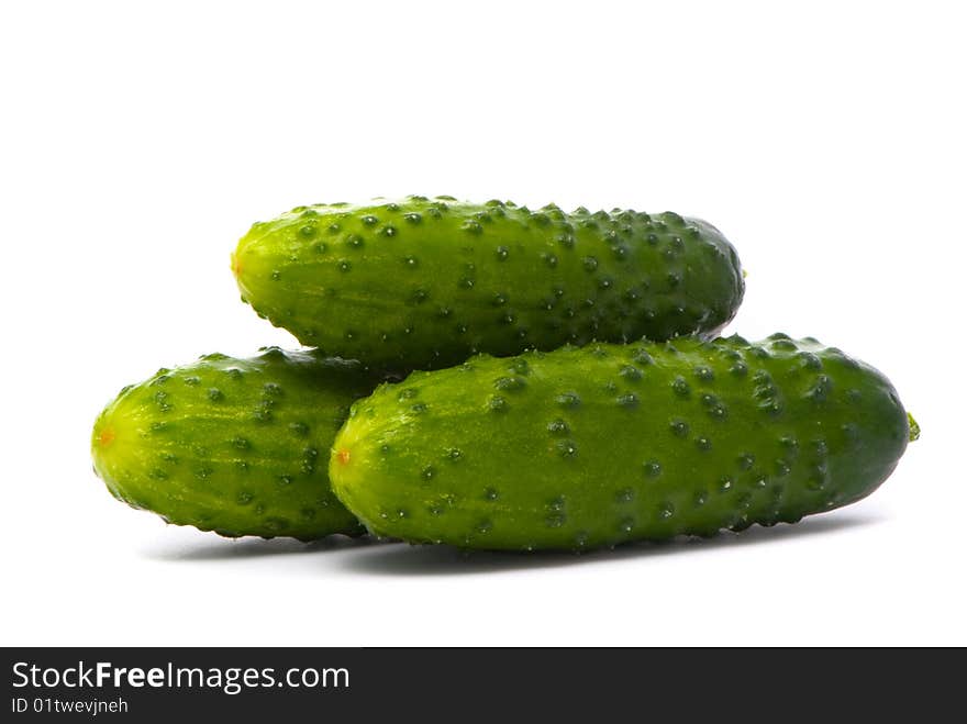 Fresh cucumbers on studio white