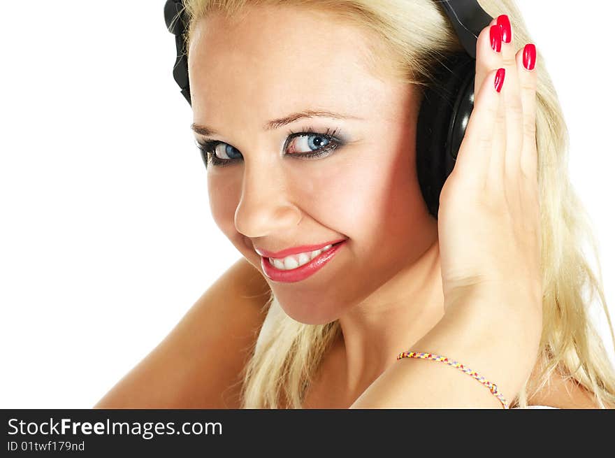 Beautiful girl listening music on white background