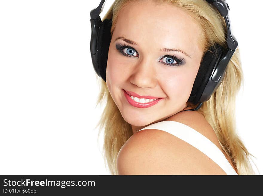 Beautiful girl listening music on white background