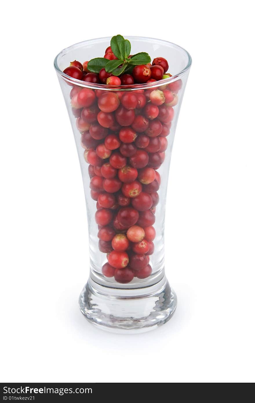 Cranberries in glass on white background.