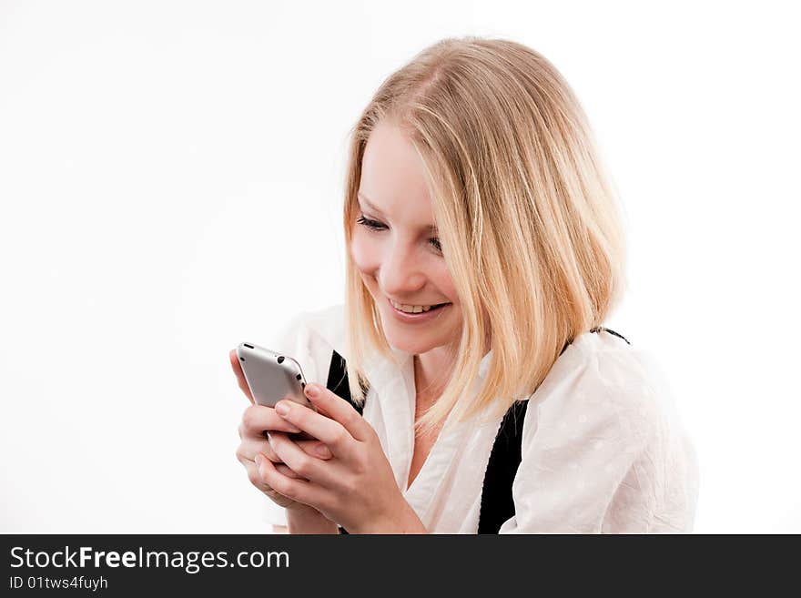 Young woman using mobile looks coy or in love. Young woman using mobile looks coy or in love