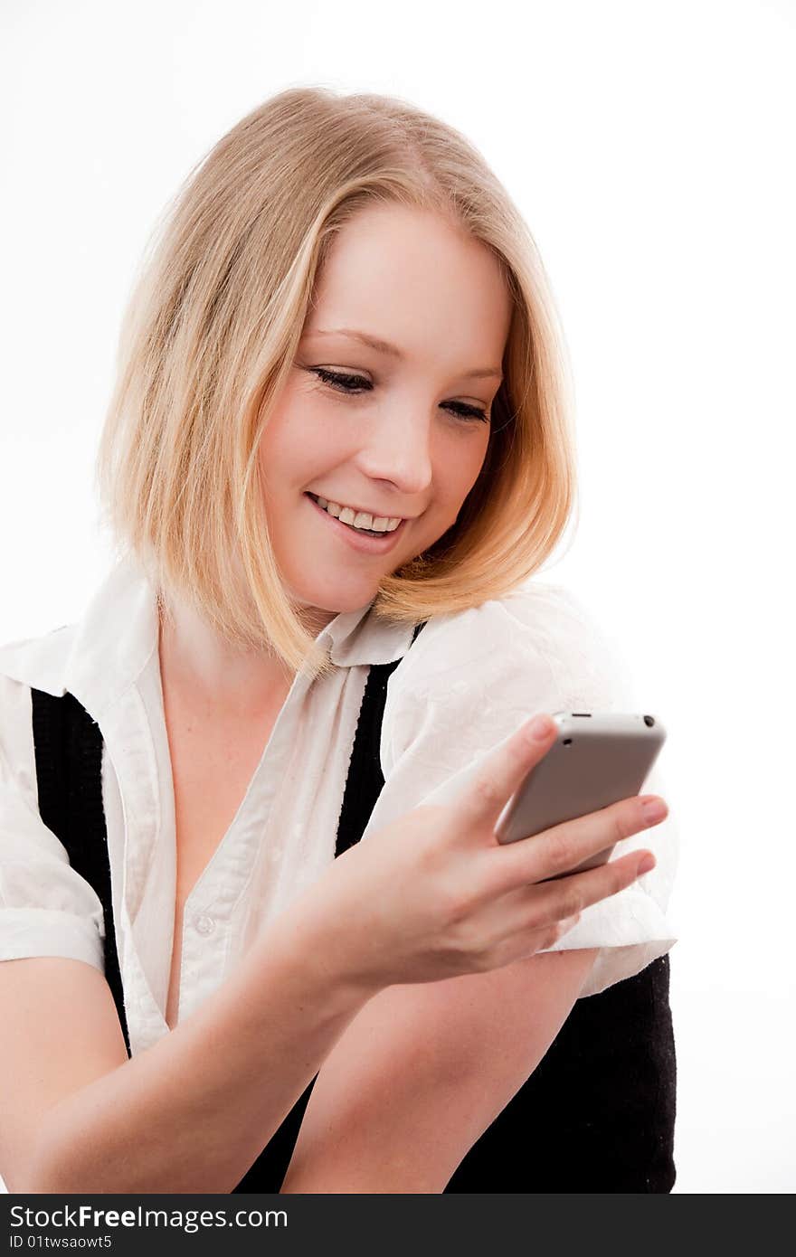 Young woman using mobile looks coy or in love. Young woman using mobile looks coy or in love