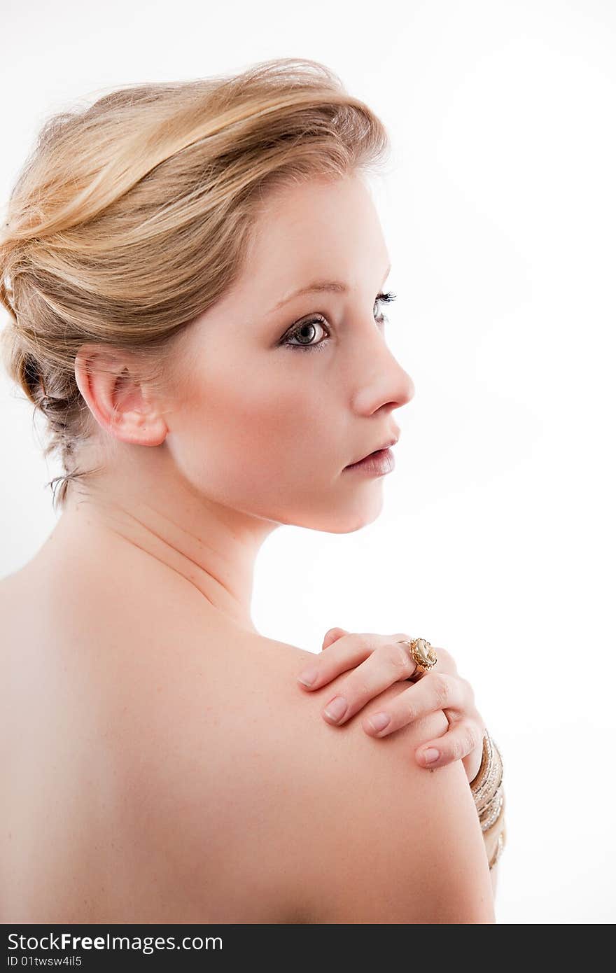 Young woman looks elegantly over her shoulder