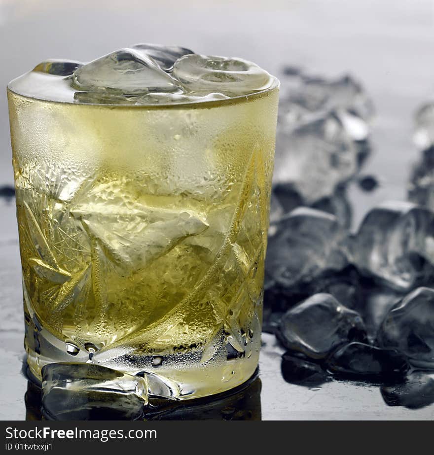 Glass of whiskey with ice