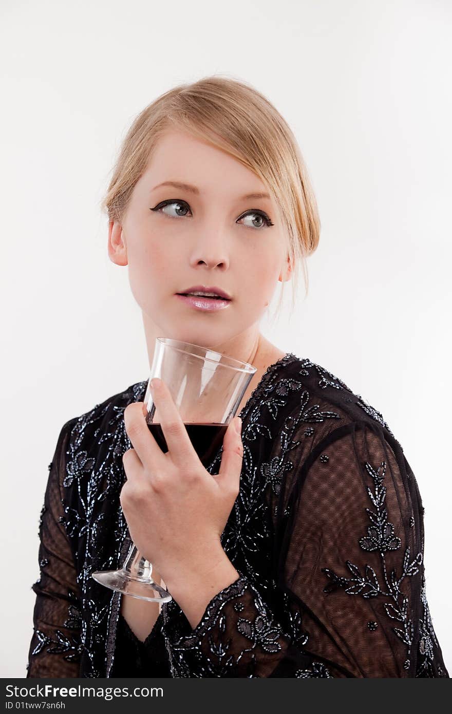 Young woman holding a glass of red wine