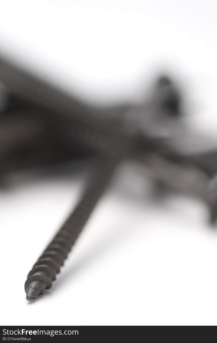 Macro image of screws on white background