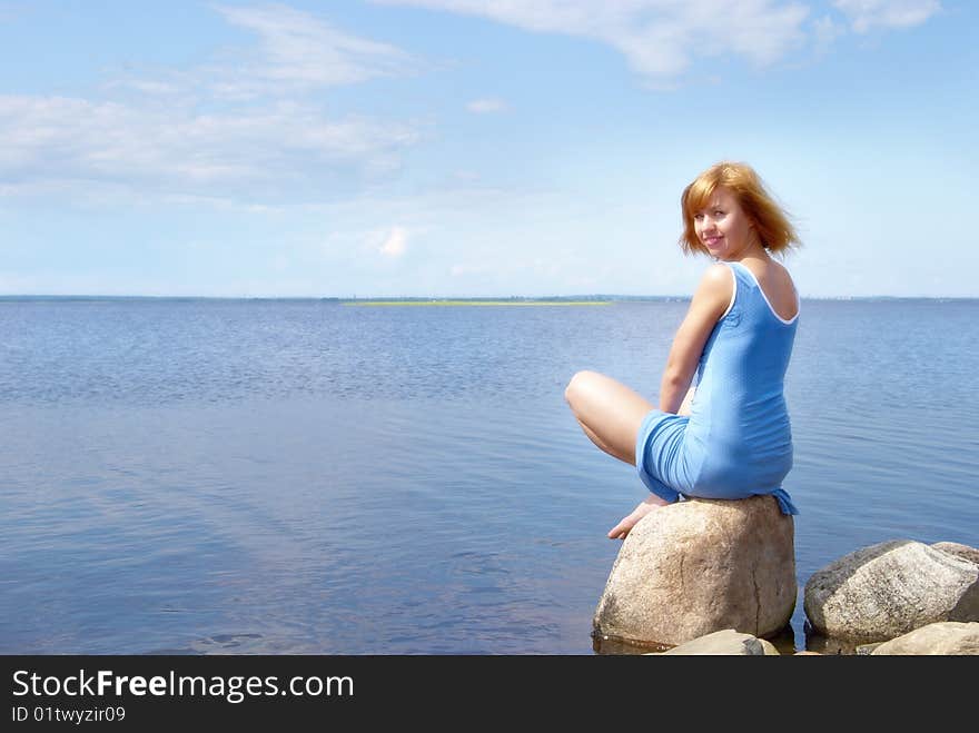 Woman On The Shore Stone