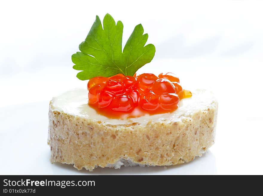 Red caviar with bread and butter over white plate. Red caviar with bread and butter over white plate