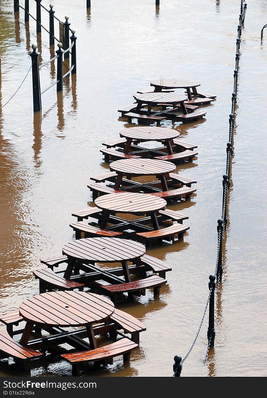 Abandoned tables during flooding of York River Ouse. Abandoned tables during flooding of York River Ouse.