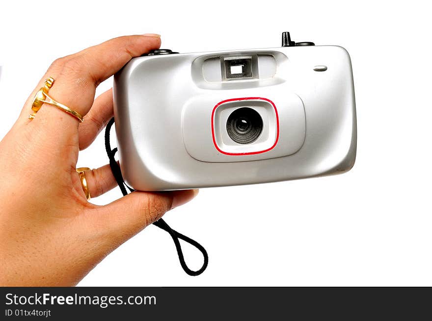 Female hand holding camera on white background. Female hand holding camera on white background.