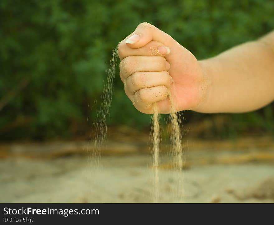 Photo of hands with sand