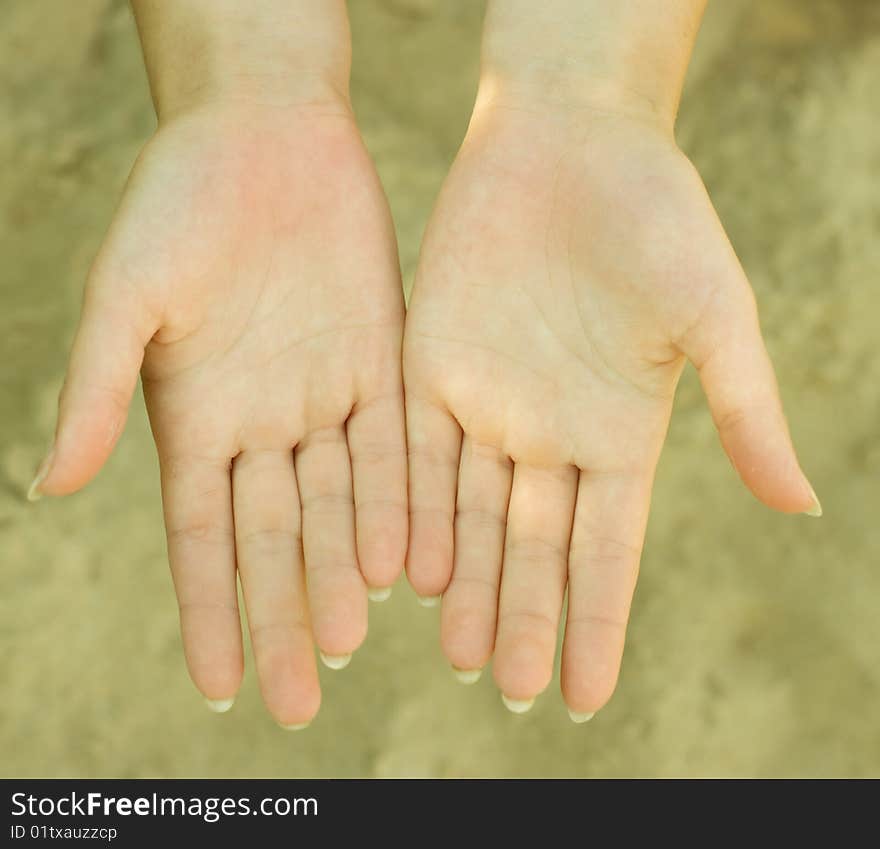 Photo of hands with sand