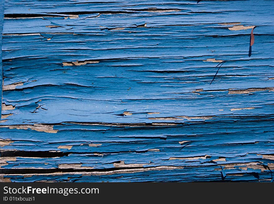 Peeling blue painted plank useful as background or texture. Peeling blue painted plank useful as background or texture