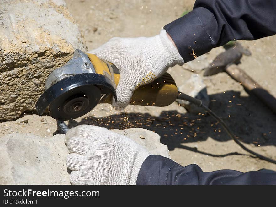 Worker hand with circular saw