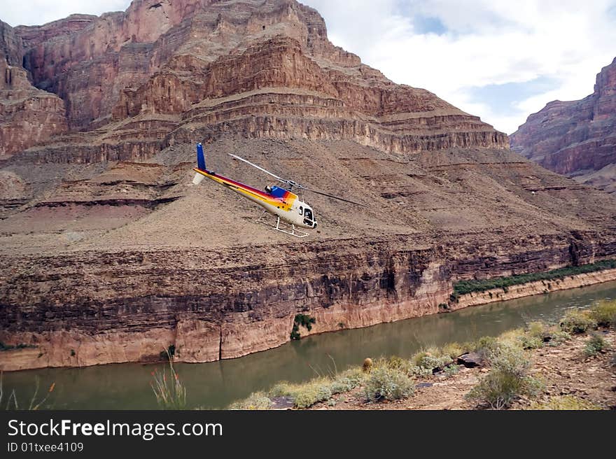 Chopper flying over Colorado River. Grand Canyon, West Rim. Arizona, USA. Chopper flying over Colorado River. Grand Canyon, West Rim. Arizona, USA.