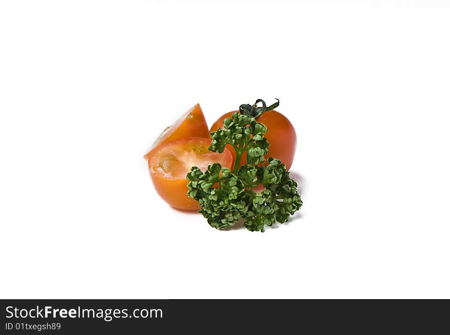 Cherry tomato and parsley on white background