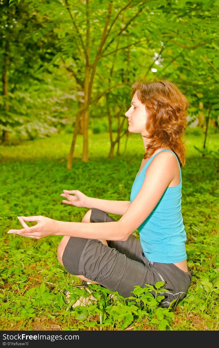 Young woman in meditating pose. Young woman in meditating pose