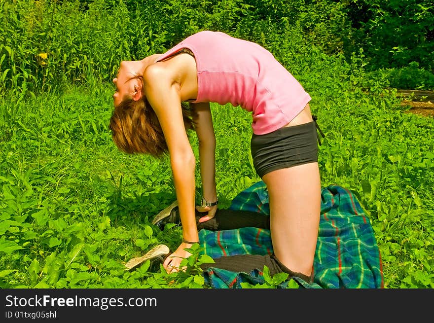 Girl in yoga pose in the park. Girl in yoga pose in the park