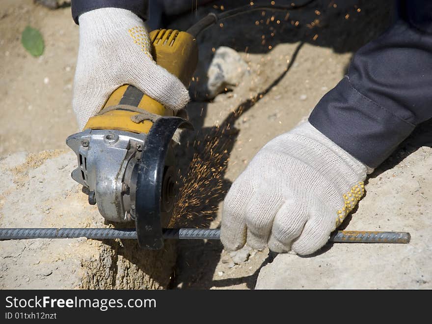 Worker hand with circular saw